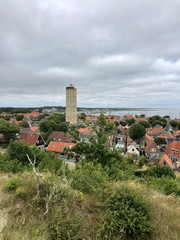 Fototapeta na wymiar Town West-Terschelling with the lighthouse Brandaris