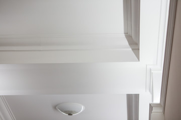 Interior details ceiling stucco plaster. Decorating wall joint using lighting © Parilov