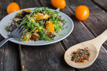 Healthy salad with grilled eggplant, greens and arugula.