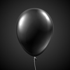 Black balloon isolated on grey background.