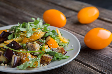 Healthy salad with grilled eggplant, greens and arugula.