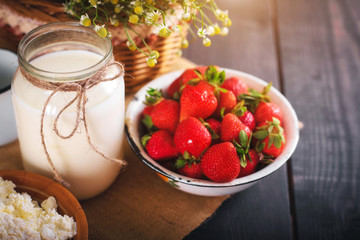 Still life of farm products. Milk and strawberry close-up.