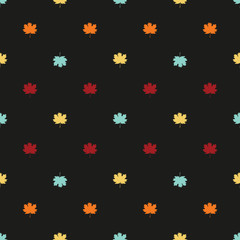 Seamless pattern with autumn maple leaves.  Blue, yellow, orange and red eaves on dark background. Vector illustration