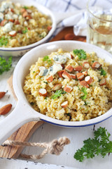 Bulgur cereal risotto with blue cheese, parsley and almonds, two servings