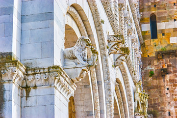 The stone sculptures on the frontage of Lucca Cathedral, Italy