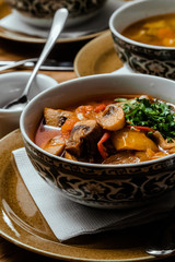 Traditional Uzbek oriental cuisine. soup with lamb meat. Copy space, selective focus
