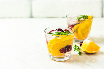 Citrus cranberry rosemary cocktail. Selective focus, space for text.