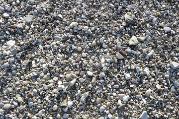 Stone beach floor background texture of pepple beach stones horizontal