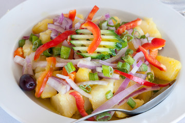 Potato salad with onions red peppers spring onion