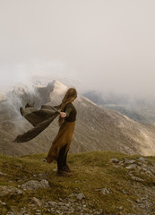 Woman on top of mountain in the clouds in wales - 226841131