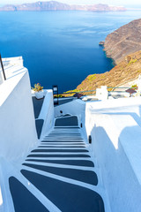Santorini, Greece. Picturesque view of traditional cycladic Santorini houses on cliff - obrazy, fototapety, plakaty