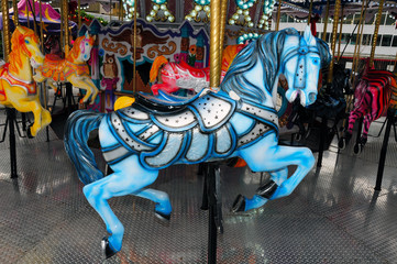 Fototapeta na wymiar Blue carousel horse at the fair
