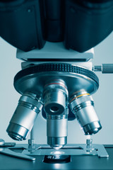 Fototapeta na wymiar Close-up shot of modern microscope with sample slide at laboratory.