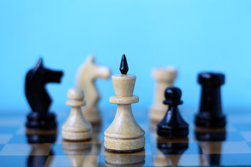 Chess pieces on a board.