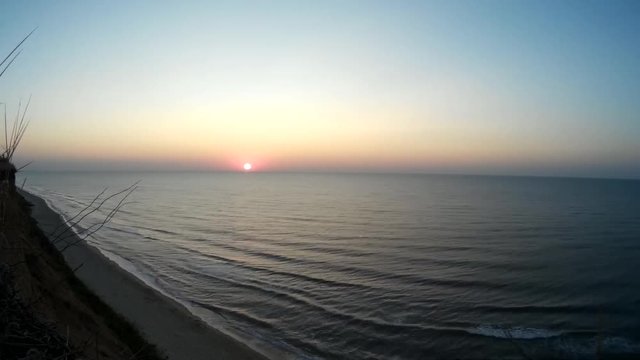 Sunrise on a sea cliff timelapse
