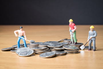 MINIATURE WORKERS WORK AT NIGHT / DRILLING, DIGGING, SWEEPING IN PILE OF COINS