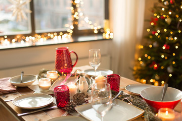 christmas, holidays and eating concept - table served for festive dinner at home