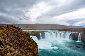 Icelandic waterfall in Icelandic natural landscape. Famous sights and attractions in Icelandic natural landscape on Southern Iceland
