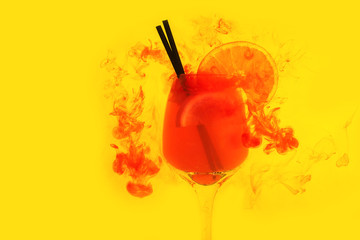 water red background white inside under paints acrylic smoke streaks aperol spritz cocktail glass orange juice yellow