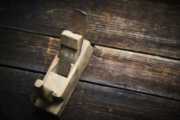 Carpenter tabletop with old hand plane. Traditional woodworking.