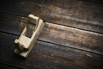 Carpenter tabletop with old hand plane. Traditional woodworking.