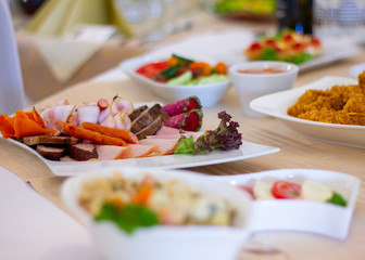 A table with food and drinks at party