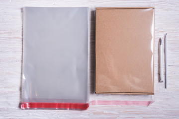 Clear plastic bags and cardboard box