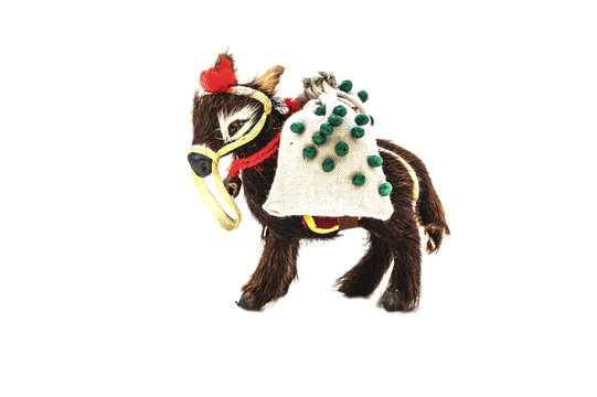 Miniature toy of wool in the form of a donkey with a bag
