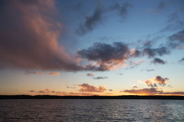 Sunset lake landscape. Beautiful colorful clouds. 