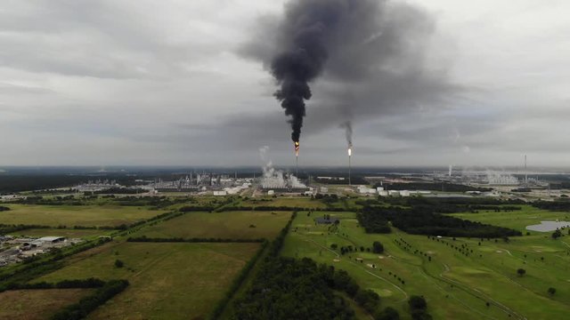 Chemical Plant Conducting Controlled Flaring to Burn Off Excess Materials in Channelview near Houston, Texas Filmed by Drone