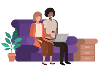 couple sitting in the living room with laptop