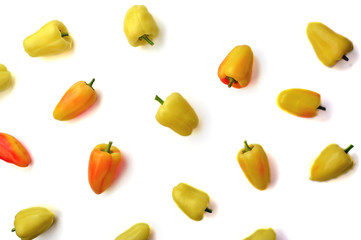Chaotic background of vegetables. Sweet pepper on a light background. Sweet peppers. Raw vegetables. Flat lay, top view, copy space.Isolated on white background.
