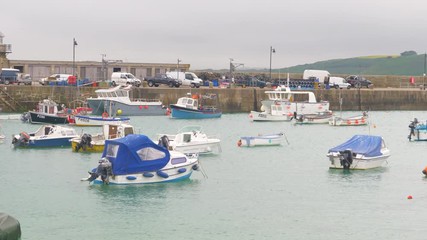 Panorama of St Ives harbour as fishermen get their boats ready for departure at dawn.