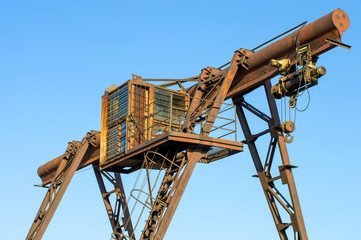 gantry crane, telpher, old, ancient, past, broken, abandoned, rusty, closed production, work; orange; metal; environment; vintage; old; ancient; past; broken; abandoned; rusty; closed production