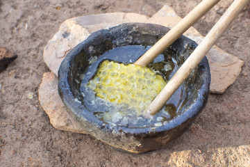 Honeycomb in primitive clay bowl