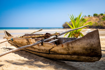 Madagascan pirogue boats at sunset on Nosy Be, Madagascar. Blurred background.