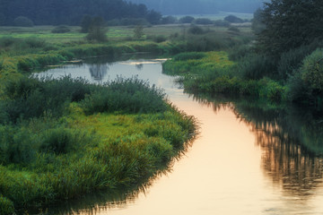 Summer landscape with meanderin river in countryside.