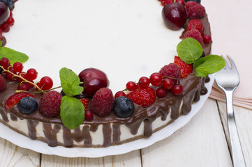 Sweet Cake with fresh berries on wooden background. Top view
