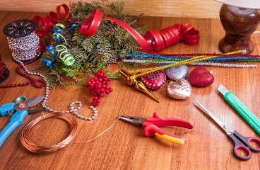 Fototapeta na wymiar The process of making handicraft christmas wreath, tools and decorations