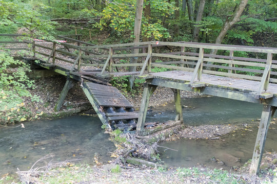 broken bridge over a small stream