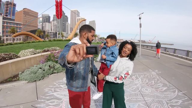 Family takes photo near San Francisco bay, POV
