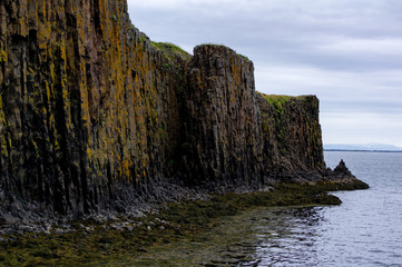 Basalt rocks reflected in an ocean near the city Stykkish&oacute;lmur in Iceland