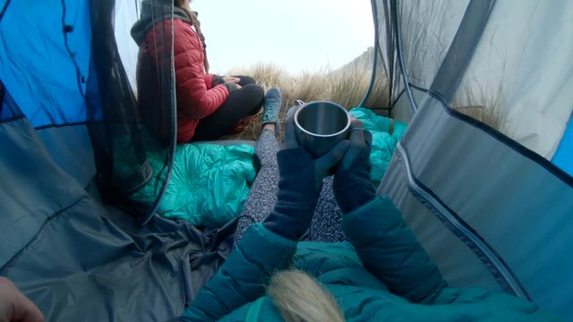Relaxing in tent on foggy day, POV