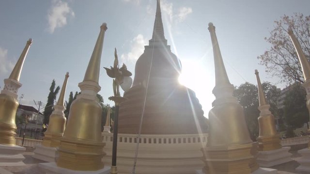 POV, sun shines over Phuket Thailand Temple