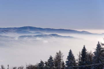 winter mountains up above the clouds