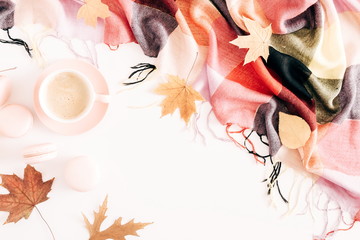 Autumn composition. Cup of coffee, macaroons, checkered plaid, dried leaves on white background. Autumn, cozy fall concept. Flat lay, top view, copy space 