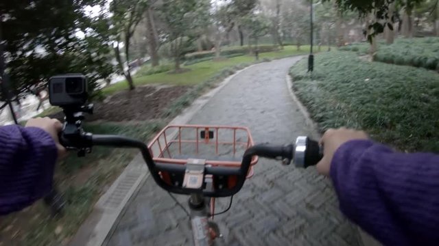 POV, riding bike through park in Shanghai