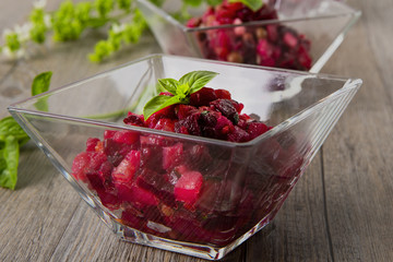 Salad from the beet. Vinegret is a traditional Russian salad made from beets and vegetables. Two bowls with salad.