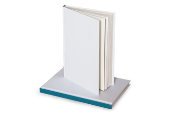Blank white book with hardcover on top of another book isolated