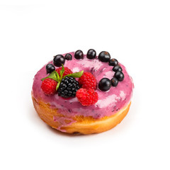 Donut with pink cream and berries, isolated on white background. Viewing forty-five degrees.